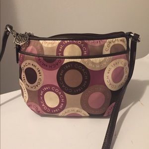 Beautiful purple colored coach cross body bag